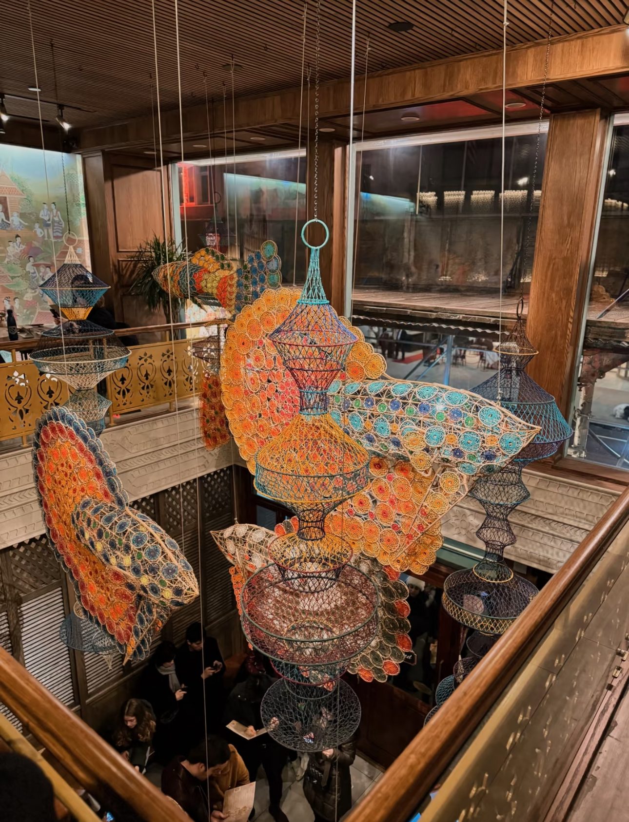 Woven fish sculptures floating above the Mitr Thai dining room
